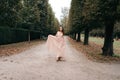 Young beautiful woman in long rose evening dress Royalty Free Stock Photo