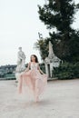 Young beautiful woman in long rose evening dress Royalty Free Stock Photo