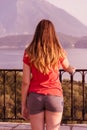 Young beautiful woman looking at  beautiful seascape with a lookout point Royalty Free Stock Photo