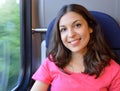 Young beautiful woman looking through the train window. Royalty Free Stock Photo