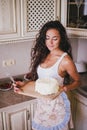 Young beautiful woman making cake at the kitchen Royalty Free Stock Photo