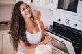 Young beautiful woman making cake at the kitchen Royalty Free Stock Photo
