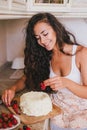 Young beautiful woman making cake at the kitchen Royalty Free Stock Photo