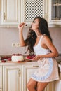 Young beautiful woman making cake at the kitchen Royalty Free Stock Photo