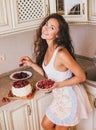 Young beautiful woman making cake at the kitchen Royalty Free Stock Photo