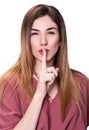 Young beautiful woman making silence gesture. Royalty Free Stock Photo
