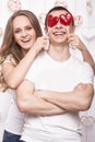 Young, beautiful woman and man in love on Valentine's Day with candy, Laughing Happy Lovers, showing different poses. Royalty Free Stock Photo