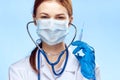 Young beautiful woman in medical clothes holds a syringe, medicine, doctor Royalty Free Stock Photo