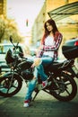 Young beautiful woman on motorcycle Royalty Free Stock Photo