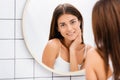 young beautiful woman near mirror on Royalty Free Stock Photo