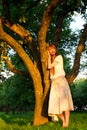 Young beautiful woman next to apple tree Royalty Free Stock Photo