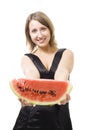 Young beautiful woman offer piece of watermelon Royalty Free Stock Photo