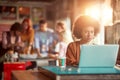 Young beautiful woman in the office is focused on a work on the laptop Royalty Free Stock Photo