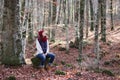 Young beautiful woman in one of the most amazing beech forest in Europe, La Fageda d'en Jorda, an amazing forest.