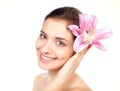Young beautiful woman with pink flower Royalty Free Stock Photo