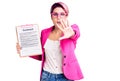 Young beautiful woman with pink hair holding clipboard with contract document doing stop gesture with hands palms, angry and