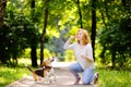 Young beautiful woman playing with Beagle dog Royalty Free Stock Photo