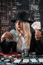 young beautiful woman playing poker in casino, make a bet to all in Royalty Free Stock Photo