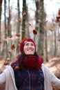 Young beautiful woman plays with beech leaves in one of the most amazing beech forest in Europe, La Fageda d'en Jorda.