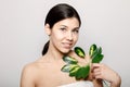 Young Beautiful Woman Posing With Green Plant Branchlet