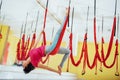 Young beautiful woman practicing yoga Fly with a hammock in the bright studio. The concept of mental and physical health Royalty Free Stock Photo