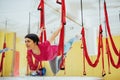 Young beautiful woman practicing yoga Fly with a hammock in the bright studio. The concept of mental and physical health Royalty Free Stock Photo