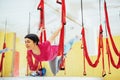 Young beautiful woman practicing yoga Fly with a hammock in the bright studio. The concept of mental and physical health Royalty Free Stock Photo