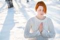 Young beautiful woman praying in forest Royalty Free Stock Photo