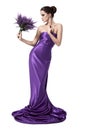 Young beautiful woman in purple dress with flower. Royalty Free Stock Photo