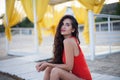 Young beautiful woman in red bikini with long curly hair posing Royalty Free Stock Photo