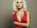 Young beautiful woman in red dress.Sexy body Blond girl Royalty Free Stock Photo