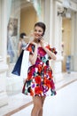 Young beautiful woman in red flowers dress