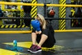 Young beautiful woman relaxes after a fight or training session and cries Royalty Free Stock Photo