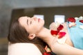 Young beautiful woman relaxing in beauty spa after massage Royalty Free Stock Photo