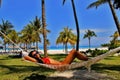 Young beautiful woman Relaxing In Hammock On The Tropical Beach Royalty Free Stock Photo