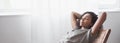 Young beautiful woman relaxing at home panoramic banner. Cute african american girl resting in her room. Royalty Free Stock Photo