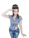 Young beautiful woman in retro pin up style saluted isolated