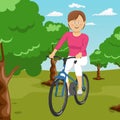 Young beautiful woman riding a bicycle in a park. Active people. Outdoors