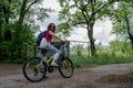 Young beautiful woman riding yellow bicycle in Ukraine