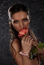 Young woman with rose under rain. Royalty Free Stock Photo