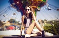 Young beautiful woman in round hipster sunglasses and with long Royalty Free Stock Photo