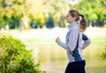 Young Beautiful Woman Running in the Autumn Park Royalty Free Stock Photo