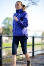 Young Beautiful Woman Running in the Autumn Park Royalty Free Stock Photo