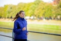 Young Beautiful Woman Running in the Autumn Park Royalty Free Stock Photo