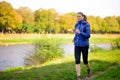 Young Beautiful Woman Running in the Autumn Park Royalty Free Stock Photo