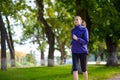 Young Beautiful Woman Running in the Autumn Park Royalty Free Stock Photo