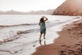 Young beautiful woman running by the beach at sunset. Relax and holidays concept Royalty Free Stock Photo