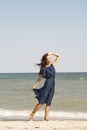 Young beautiful woman at seaside in blue dress Royalty Free Stock Photo