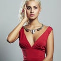 Young beautiful woman.Sexy body Blond girl.red dress