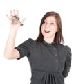 Young beautiful woman showing apartment keys on white background